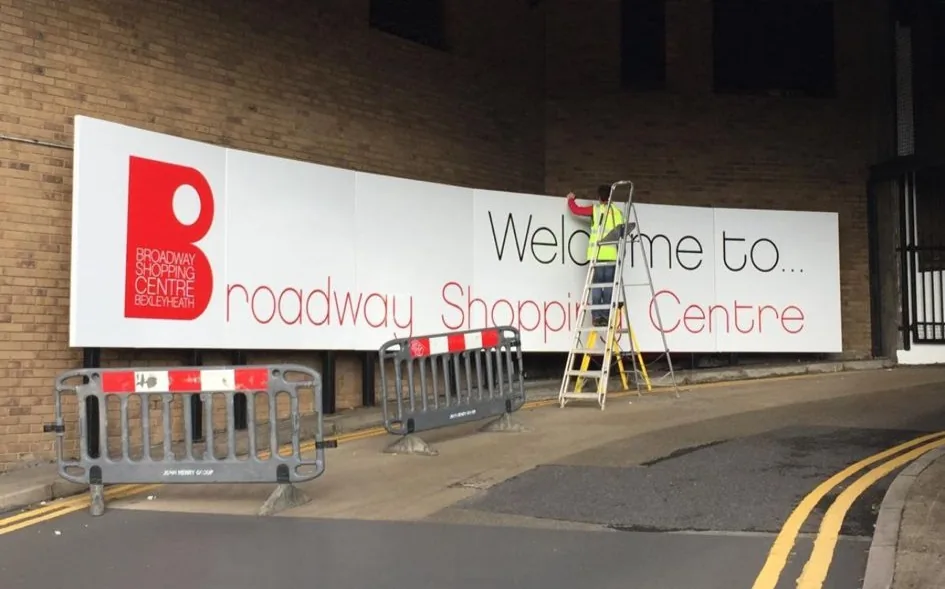 Broadway Shopping Centre hoarding installation in progress by Talion Graffix